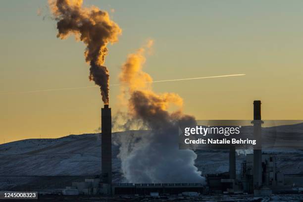 Mixture of steam and pollutants are emitted from the Naughton coal-fired power plant November 22, 2022 in Kemmerer, Wyoming. The plant, operated by...