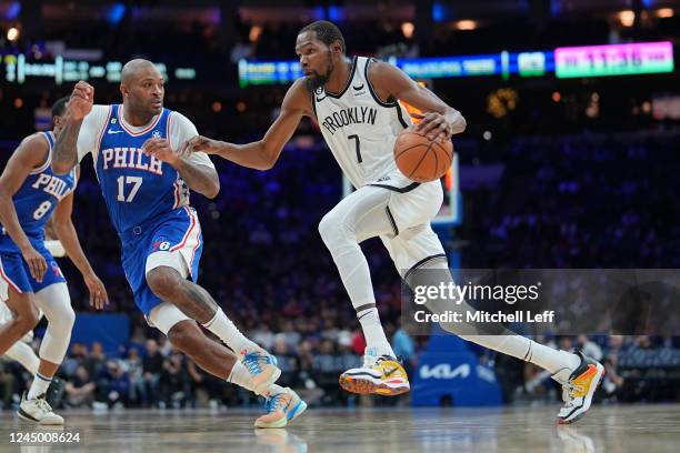 Kevin Durant of the Brooklyn Nets drives to the basket against P.J. Tucker of the Philadelphia 76ers in the third quarter of the game at the Wells...