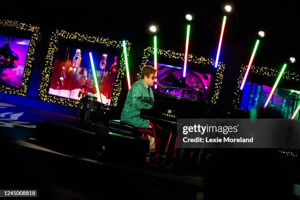 Sir Elton John performs in the opening ceremony for Saks Fifth Avenue's Holiday Windows and Light show on November 22, 2022 in New York City.