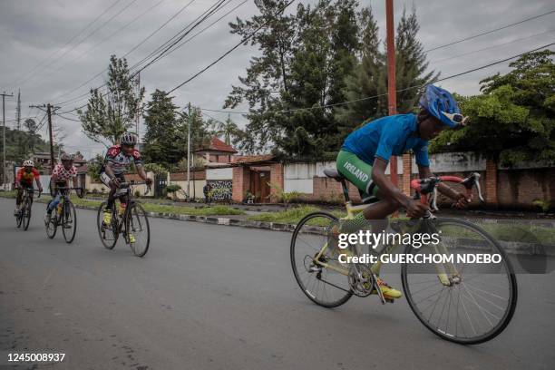 Cyclists of the Goma Cycling Centre make their way through the streets of Goma during a traning session on November 20, 2022. - The M23 rebels are...