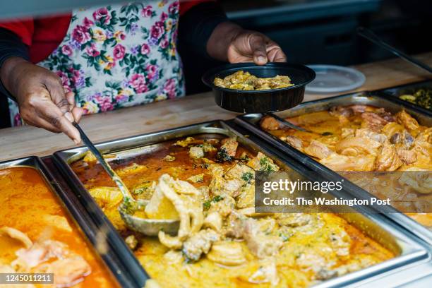 Chef Kwame Onwuachi and his mother Jewel order egusi stew and beef suya at West African restaurant Accra in the Bronx neighborhood he grew up in New...