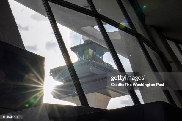 The historic control tower at Dulles International Airport can be seen through terminal windows on November 17 in Dulles, VA. The airport is...