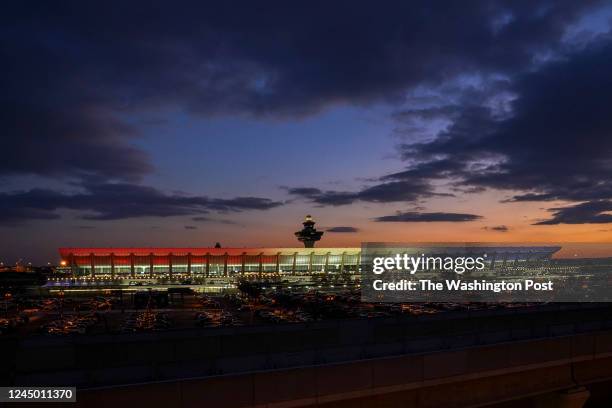 Night falls over Dulles International Airport and its historic control tower on November 17 in Dulles, VA. The airport is celebrating its 60th...