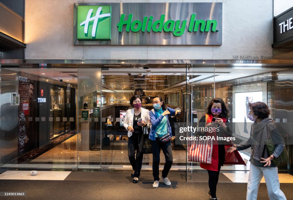 People are seen leaving the British-owned American brand of...