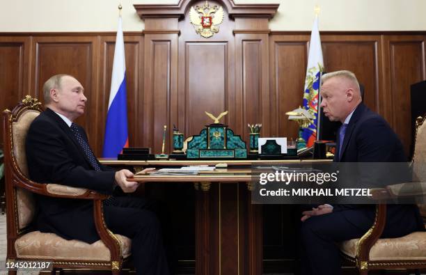 Russian President Vladimir Putin speaks with Dmitry Mazepin, Chairman of the Board of Directors of Uralchem, in Moscow, on November 23, 2022. -...