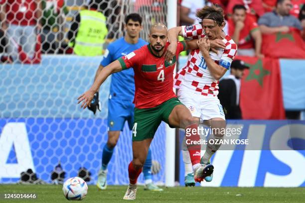 Morocco's midfielder Sofyan Amrabat and Croatia's midfielder Luka Modric fight for the ball during the Qatar 2022 World Cup Group F football match...