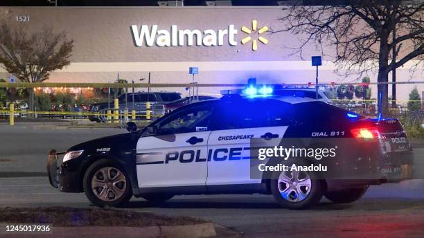 Screen grab from a video shows a police car after at least 10 people were killed in a gun attack at a supermarket in Virginia, USA on November 23,...