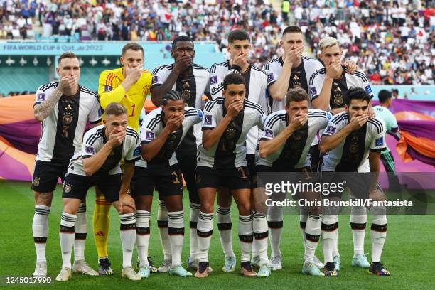 Germany line up for a team photo prior to the FIFA World Cup Qatar 2022 Group E match between Germany and Japan at Khalifa International Stadium on...