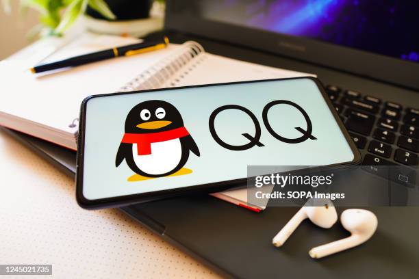 In this photo illustration, the Tencent QQ logo is displayed on a smartphone screen.
