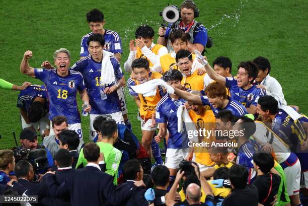 Players of Japan celebrate after winning FIFA World Cup Qatar 2022 Group E match against Germany at Khalifa International Stadium in Doha, Qatar on...