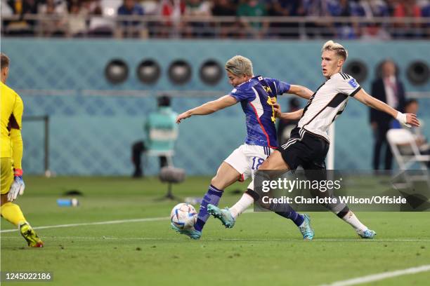 Takuma Asano scores the second goal for Japan during the FIFA World Cup Qatar 2022 Group E match between Germany and Japan at Khalifa International...