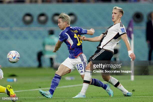 Takuma Asano of Japan scores the thirth goal to make it 1-2 during the World Cup match between Germany v Japan at the Khalifa International Stadium...