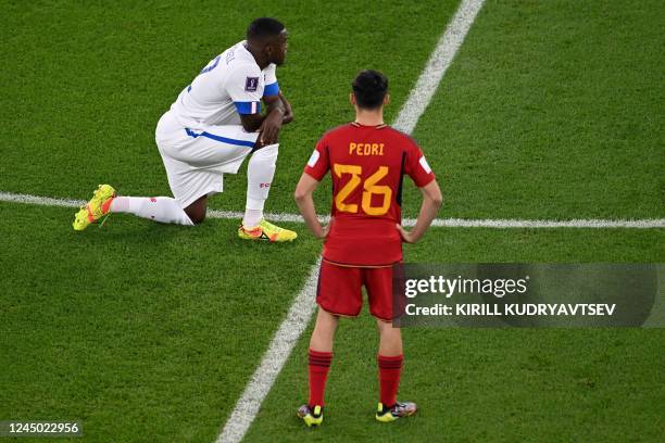 Costa Rica's forward Joel Campbell takes the knee prior to the Qatar 2022 World Cup Group E football match between Spain and Costa Rica at the...