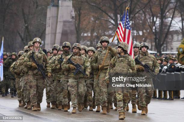 Members of the U.S. Army and soldiers from different NATO countries attend a military parade ceremony marking the 104th anniversary of the Lithuanian...