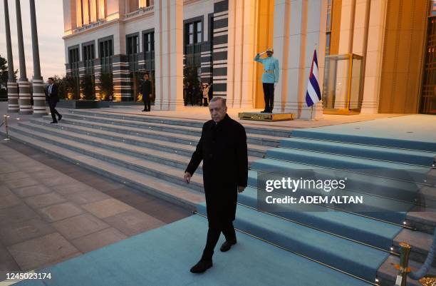 Turkish President Recep Tayyip Erdogan waits for the arrival of Cuban President before a welcoming ceremony at the Presidential Palace in Ankara, on...