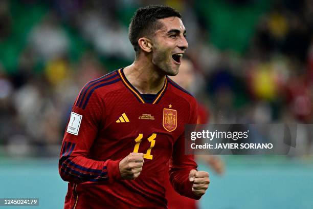 Spain's forward Ferran Torres reacts after scoring his team's third goal from the penalty spot during the Qatar 2022 World Cup Group E football match...
