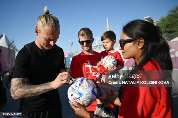 Denmark's defender Simon Kjaer meets with fans at Al Sailiya SC in Doha on November 23 during the Qatar 2022 World Cup football tournament.