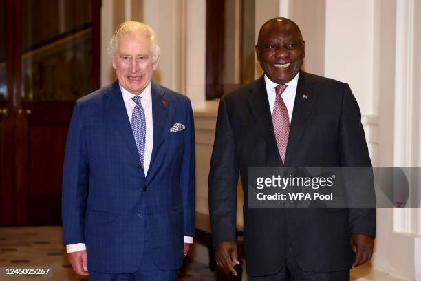 Britain's King Charles III poses for pictures with South African President Cyril Ramaphosa during a formal farewell at the end of the state visit, at...
