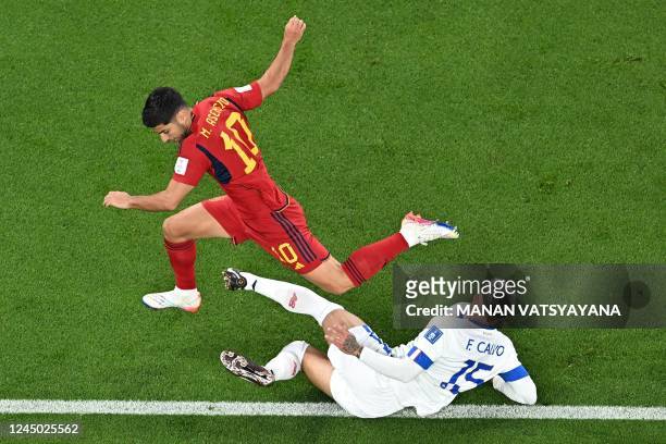 Spain's forward Marco Asensio fights for the ball with Costa Rica's defender Francisco Calvo during the Qatar 2022 World Cup Group E football match...