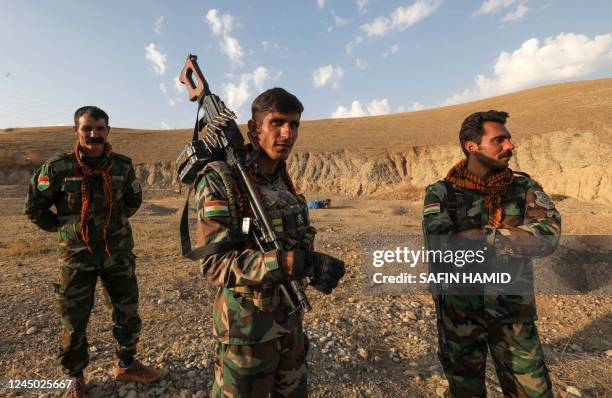 Kurdish Peshmerga fighters affiliated with Iran's separatist Kurdistan Freedom Party , man a position near town city of Altun Kupri , north of...