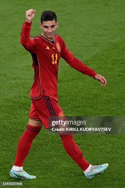 Spain's forward Ferran Torres celebrates scoring his team's third goal from the penalty spot during the Qatar 2022 World Cup Group E football match...