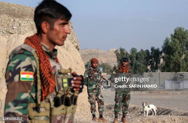Kurdish Peshmerga fighters affiliated with Iran's separatist Kurdistan Freedom Party , man a position near town city of Altun Kupri , north of...