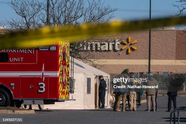 Members of the FBI and other law enforcement investigate the site of a fatal shooting in a Walmart on November 23, 2022 in Chesapeake, Virginia....