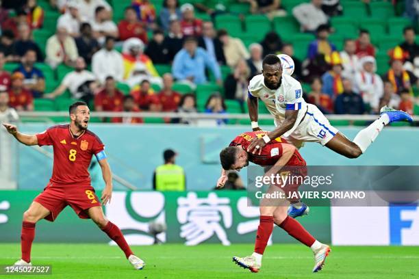 Costa Rica's midfielder Bryan Ruiz fights for the ball with Spain's defender Pau Torres during the Qatar 2022 World Cup Group E football match...