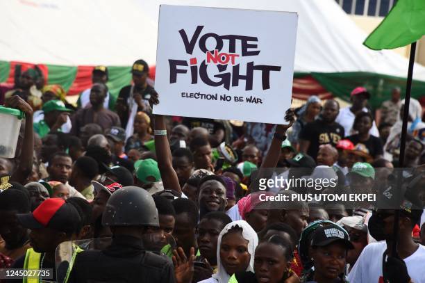 Labour Party 's supporter holds a placard during a campaign rally at Adamasingba Stadium in Ibadan, southwestern Nigeria, on November 23 ahead of the...