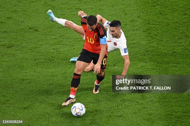 Belgium's forward Eden Hazard and Canada's midfielder Stephen Eustaquio fight for the ball during the Qatar 2022 World Cup Group F football match...