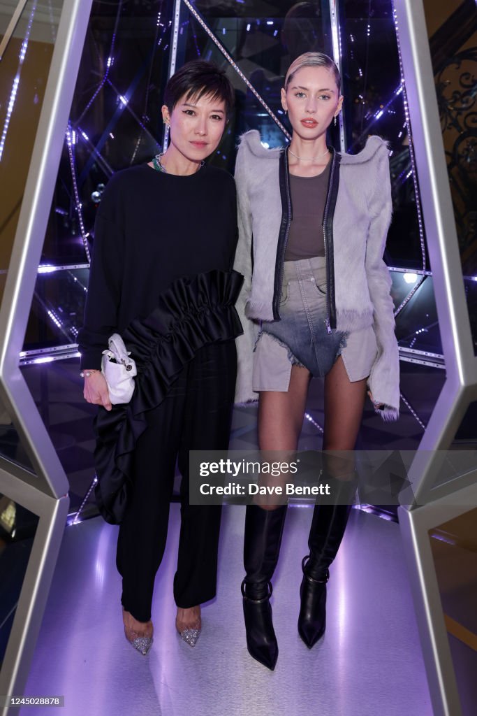Sandra Choi and Iris Law attend the Claridge's Christmas Tree Party