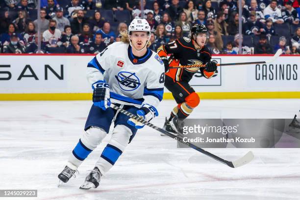 Kyle Connor of the Winnipeg Jets skates during second period action against the Anaheim Ducks at Canada Life Centre on November 17, 2022 in Winnipeg,...