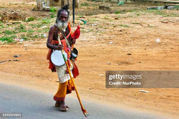 Tamil Hindu devotee walking along the road during a religious procession honouring Lord Murugan in Kilinochchi, Sri Lanka.