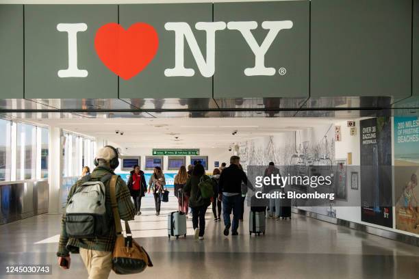 Travelers at Terminal 5 at John F. Kennedy International Airport ahead of the Thanksgiving holiday in New York, US, on Wednesday, Nov. 23, 2022....