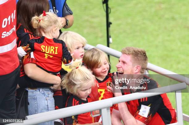 Kevin de Bruyne of Belgium talks to his children after the Qatar 2022 World Cup Group F football match between Belgium and Canada at the Ahmad Bin...