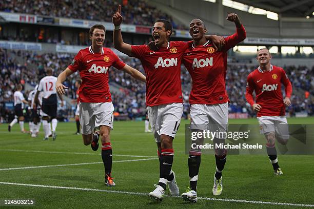 Javier Hernandez of Manchester United celebrates scoring the fourth goal with Ashley Young and Johnny Evans during the Barclays Premier League at the...