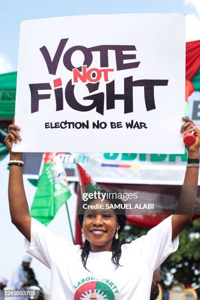 Labour Party's supporter holds a banner during a campaign rally at Adamasingba Stadium in Ibadan, southwestern Nigeria, on November 23 ahead of the...