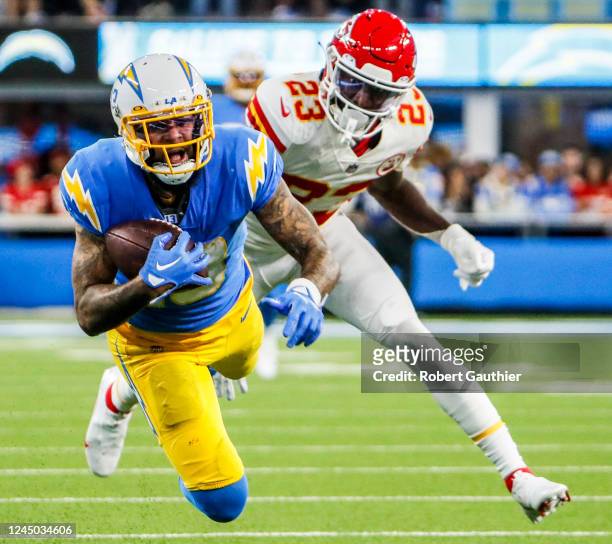 Inglewood, CA, Sunday, November 20, 2022 - Los Angeles Chargers wide receiver Keenan Allen dives for a long pass over Kansas City Chiefs cornerback...