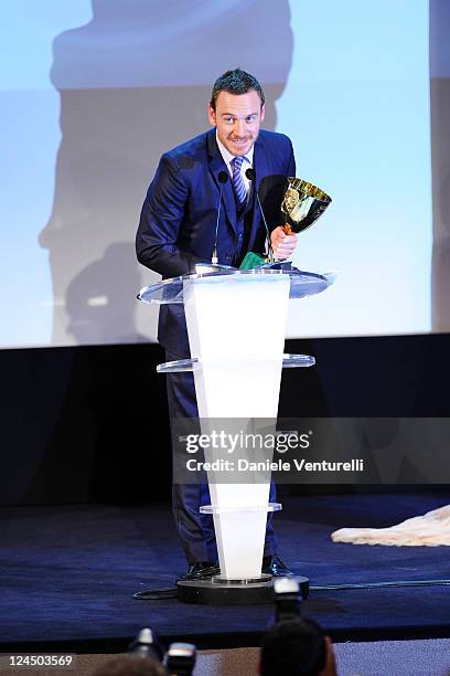 Actor Michael Fassbender of "Shame" accepts the Coppa Volpi for Best Actor during the Closing Ceremony Inside during the 68th Venice International...