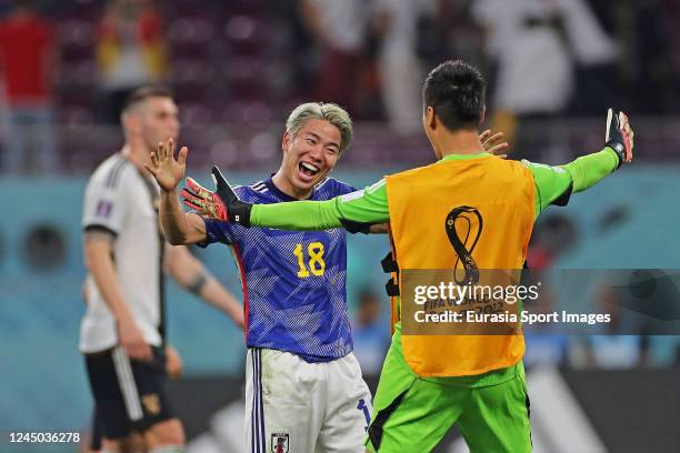 Takuma Asano of Japan celebrates with his teammates after winning Germany during the FIFA World Cup Qatar 2022 Group E match between Germany and...