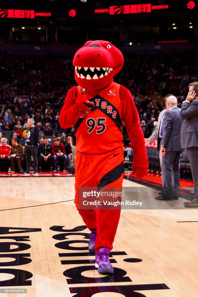 Funny Toronto Raptor The Toronto Raptors mascot, The Raptor, looks on before the game ...