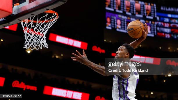 Malik Monk of the Sacramento Kings goes up for a dunk during the first half against the Atlanta Hawks at State Farm Arena on November 23, 2022 in...