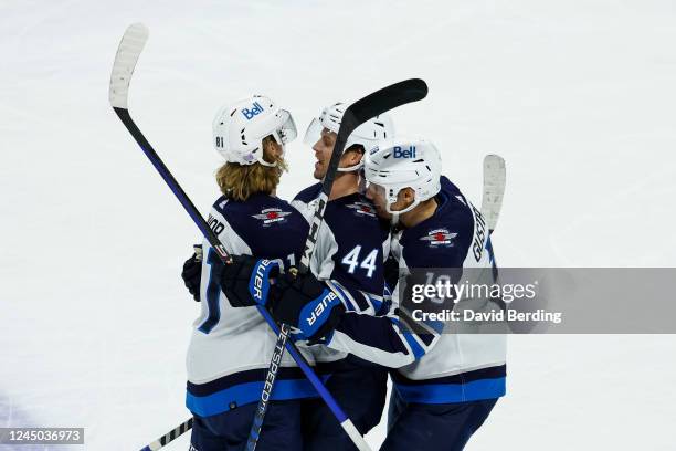 Kyle Connor of the Winnipeg Jets celebrates his goal against the Minnesota Wild with teammates in the second period of the game at Xcel Energy Center...