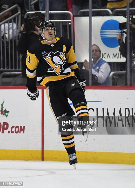 Evgeni Malkin of the Pittsburgh Penguins reacts after scoring the game winning goal in a shootout past Dan Vladar of the Calgary Flames to give the...