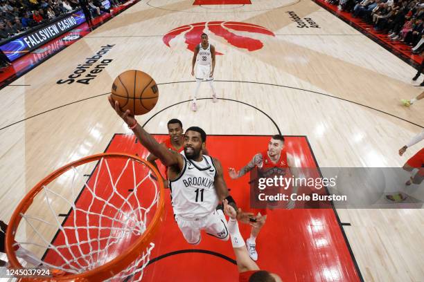 Kyrie Irving of the Brooklyn Nets drives to the net during the second half of their NBA game against the Toronto Raptors at Scotiabank Arena on...
