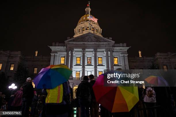 Mourners hold a candlelight vigil outside the State Capitol building on November 23, 2022 in Denver, Colorado. The vigil was in honor of the victims...