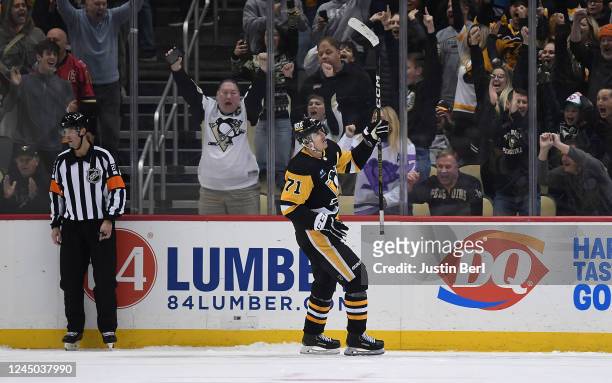 Evgeni Malkin of the Pittsburgh Penguins reacts after scoring the game winning goal in a shootout past Dan Vladar of the Calgary Flames to give the...