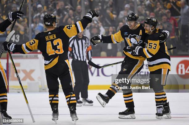 Evgeni Malkin of the Pittsburgh Penguins celebrates with Teddy Blueger and Danton Heinen eacts after scoring the game winning goal in a shootout past...