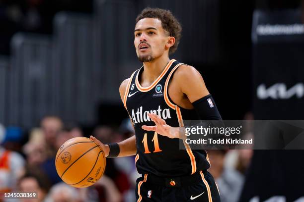 Trae Young of the Atlanta Hawks dribbles down the court during the second half against the Sacramento Kings at State Farm Arena on November 23, 2022...