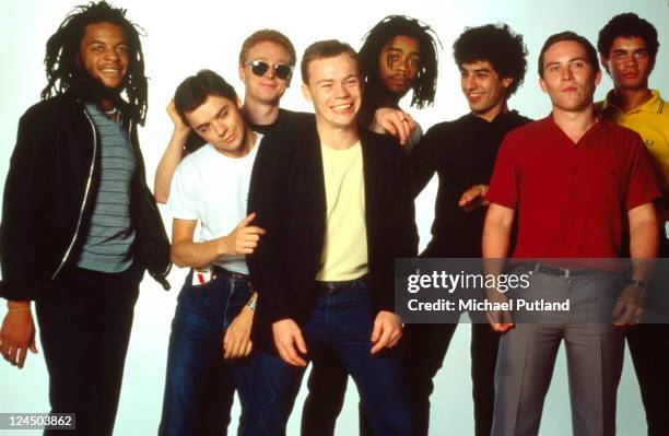 Studio group portrait, UK L-R Astro , Norman Hassan, Brian Travers, Ali Campbell, Earl Falconer, Jimmy Brown, Robin Campbell, Mickey Virtue.